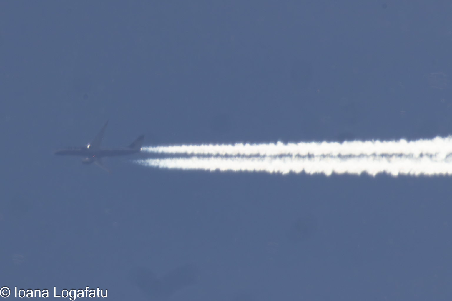 Jet soaring through the blue sky on a sunny day